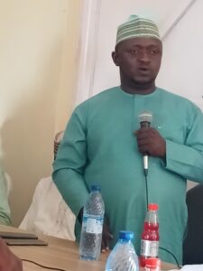 Edward Auta addressing audience at the meeting 